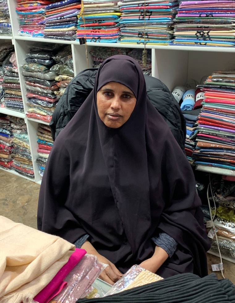 Image: Anab Ibrahim, owner of a women's boutique and a Somali-American, in her shop at the Village Market.