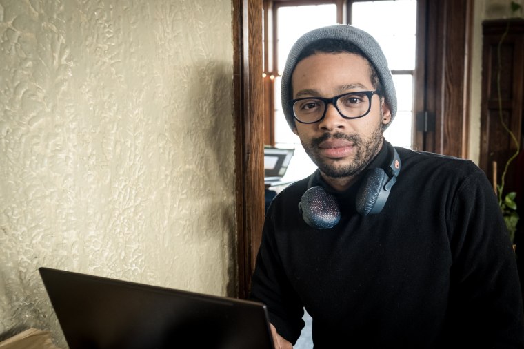 Image: Zeke Joubert, a graduate student at the University of Minnesota, at Bordertown Coffee on March 8, 2019.