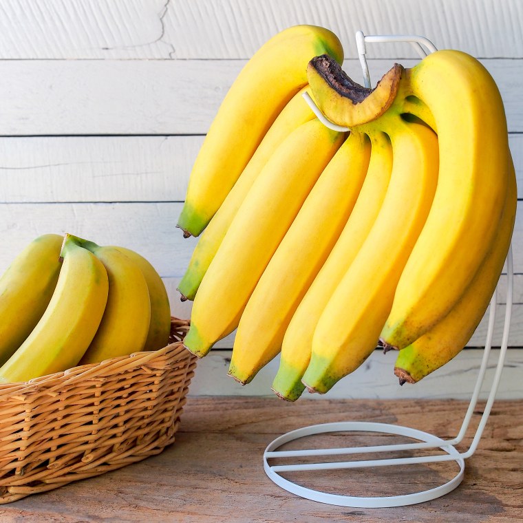 Close-Up Of Bananas With Basket On Table