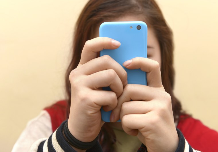 Image: Close up of a teenager on her smartphone