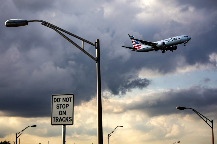 Image; An American Airlines Boeing 737 Max 8 aircraft approaches Miami International Airport in Florida on March 12, 2019.