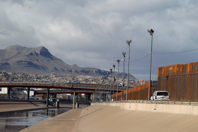 Image: A U.S. Customs and Border Protection vehicle patrols along a new section of the border fence in El Paso, Texas, U.S., as seen from Ciudad Juarez