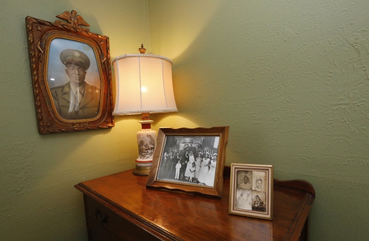 Family photographs decorate the master bedroom in the Jackson home of civil rights leaders Medgar and Myrlie Evers