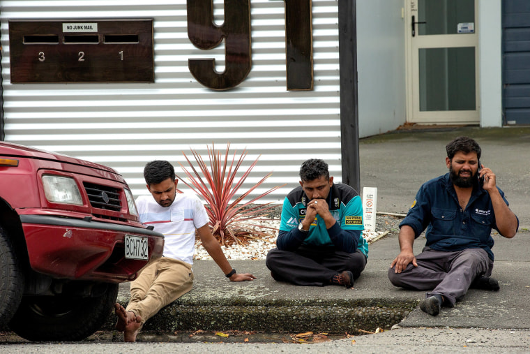 Image: Grieving members of the public following a shooting at the Al Noor mosque in Christchurch