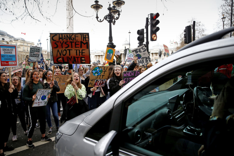 Image: Demonstrators block traffic during a protest against climate change, organised by the YouthStrike4Climate movement, in London