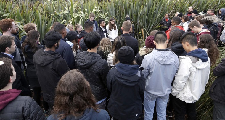 Students from the Marjory Stoneman Douglas High School in Parkland, Florida, gather after planting trees at Halswell Quarry Park Conservation Area on the outskirts of Christchurch, New Zealand, on July 24, 2018.