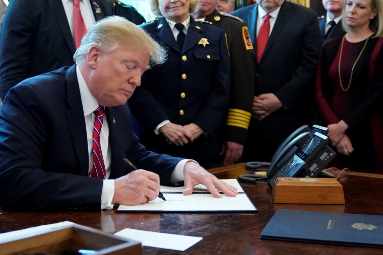 Image: President Donald Trump signs veto of congressional resolution to end emergency declaration at the White House in Washington