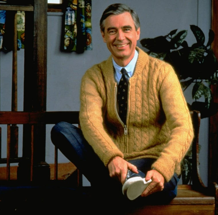 Fred Rogers poses on the Pittsburgh set of his television show  Mister Rogers' Neighborhood, in this 1996 publicity photo.  Rogers' new book, Dear Mister Rogers:  Does It Ever Rain in Your Neighborhood?, is a treasury of letters from young viewers, and Rogers' responses.