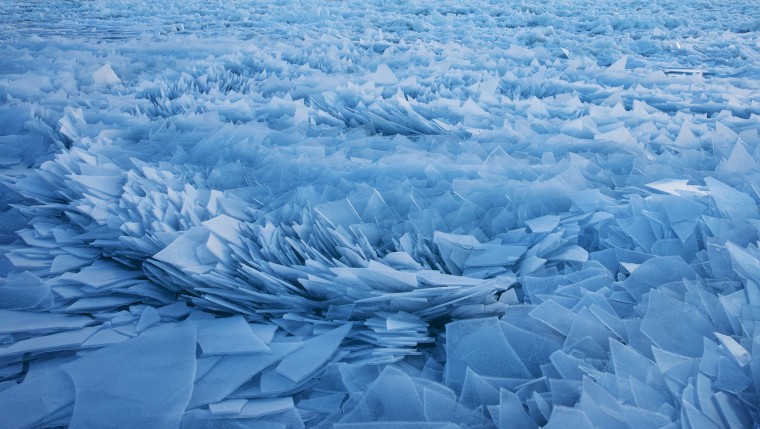 Frozen Lake Michigan thaws into crazy looking blue ice shards