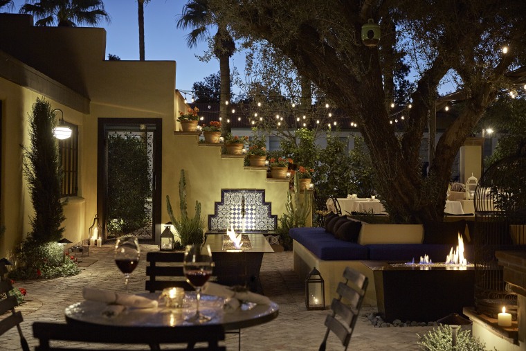 romantic dinner setting in a courtyard at Bespoke Inn in Santa Fe, New Mexico