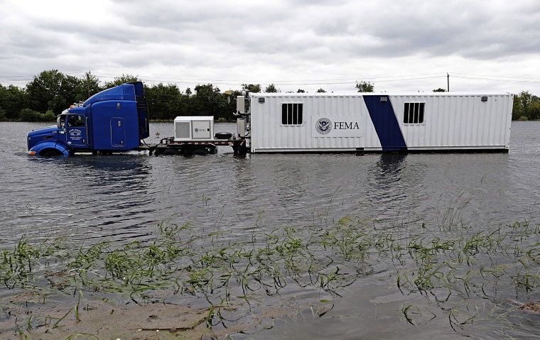 Image: A FEMA truck sits in floodwaters on the Beltway 8 feeder road