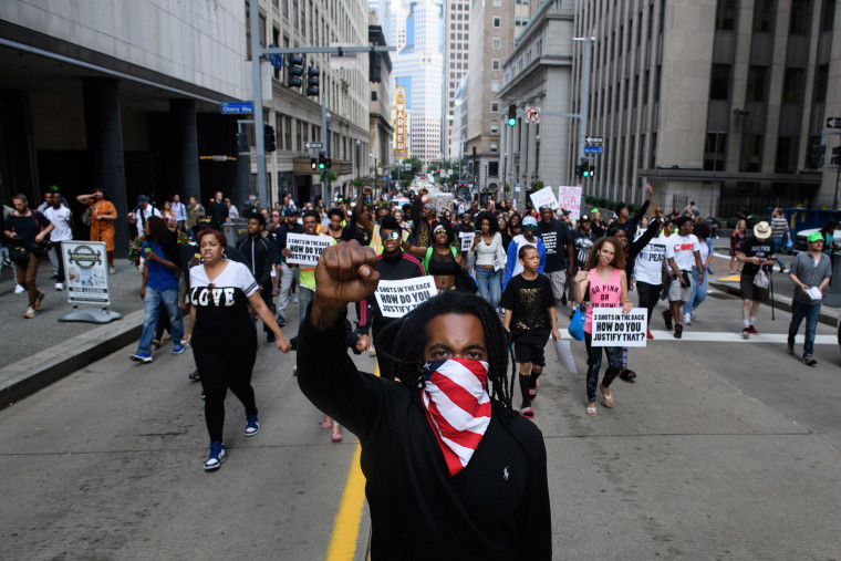 Image: Trey Willis, 32, of Washington, Pennsylvania marches during a protest a day after the funeral for Antwon Rose II