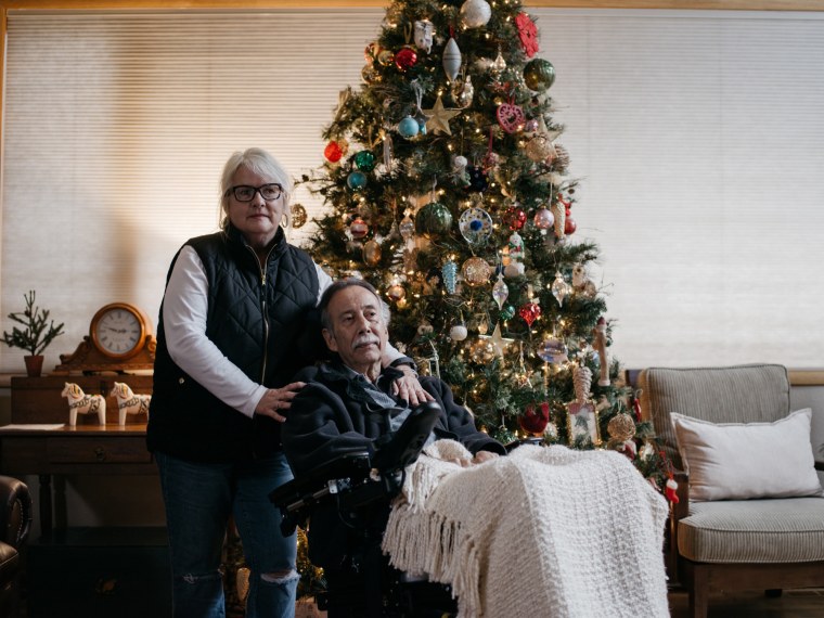 George Gallegos, and his wife, in their home.