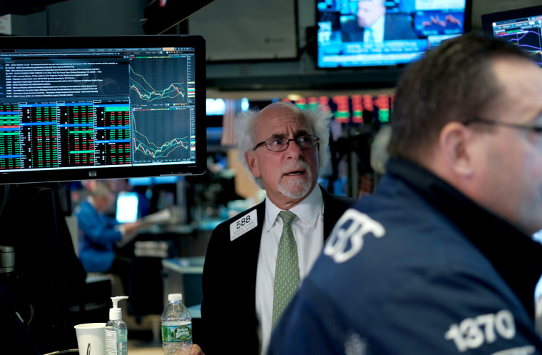Image: Traders work on the floor of the New York Stock Exchange on March 25, 2019.