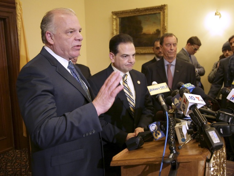 Image: Senate President Steve Sweeney, left, speaks to reporters after a vote to legalize marijuana was postponed in Trenton, New Jersey, on March 25, 2019.