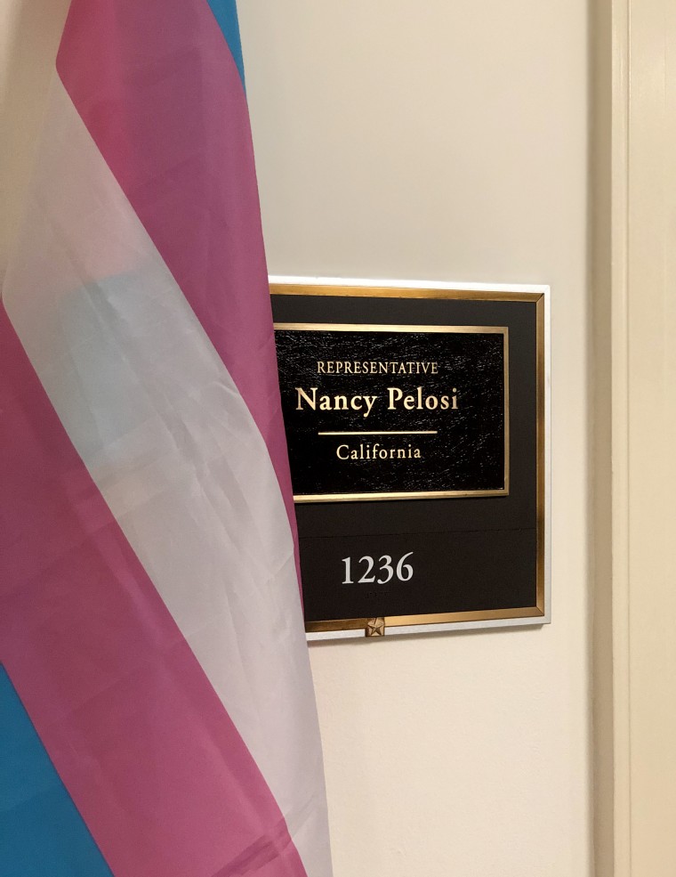 Image: A transgender flag hangs outside of Speaker of the House Nancy Pelosi's office in Washington.