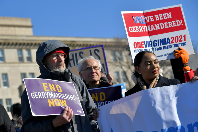 People gather during a rally to coincide with the Supreme Court hearings on the redistricting cases in Maryland and North Carolina, in front of the U.S. Supreme Court in Washington on March 26, 2019.