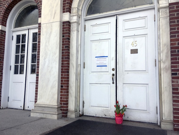 Image: Flowers sit at the entrance of Edmon Town Hall where Jeremy Richman was found dead in Newtown, Connecticut, on March 25, 2019.