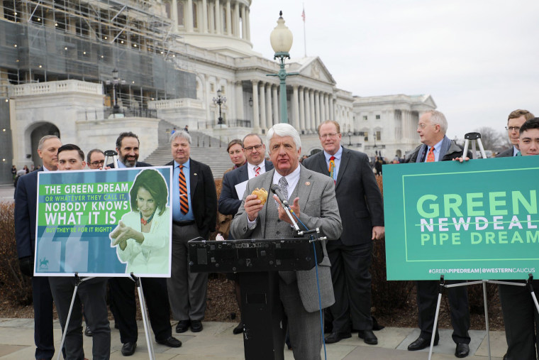 Rep. Rob Bishop, R-Utah, holds a hamburger while speaking during the Congressional Western Caucus's press conference on the Green New Deal at the U.S. Capitol on Feb. 27, 2018.