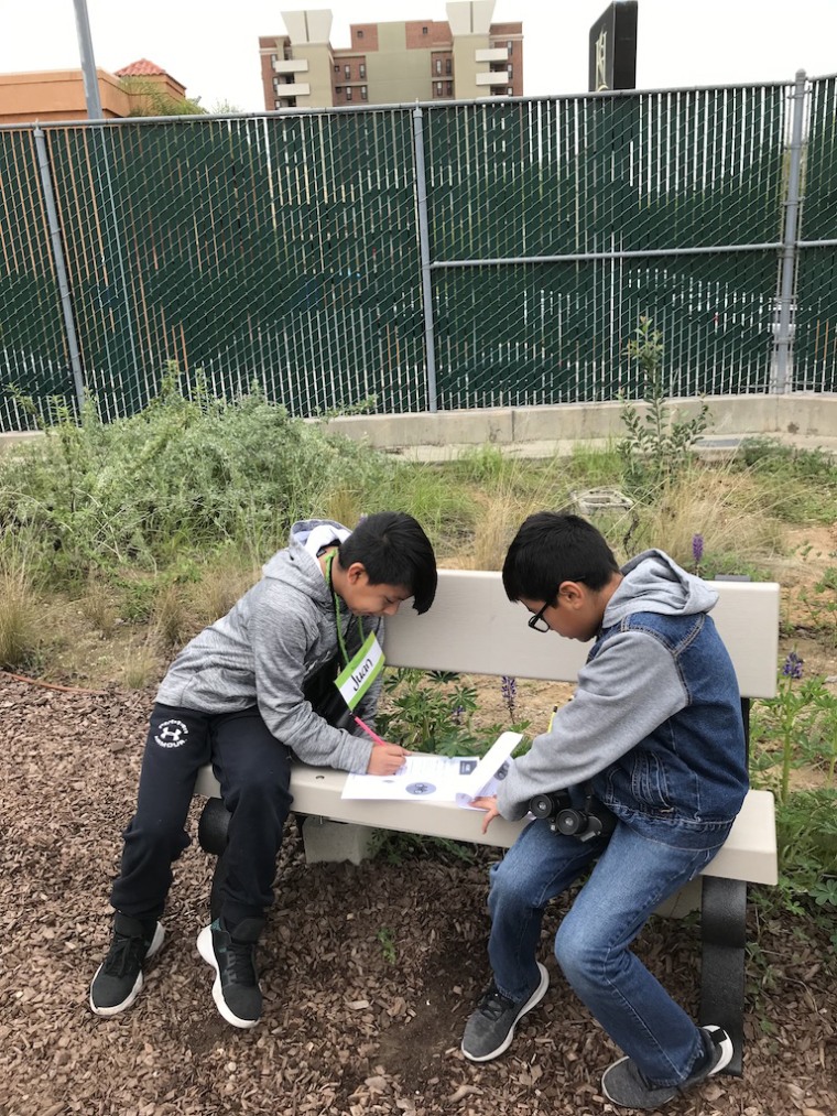 Students study worksheets in their school garden at Esperanza Elementary School in Los Angeles.