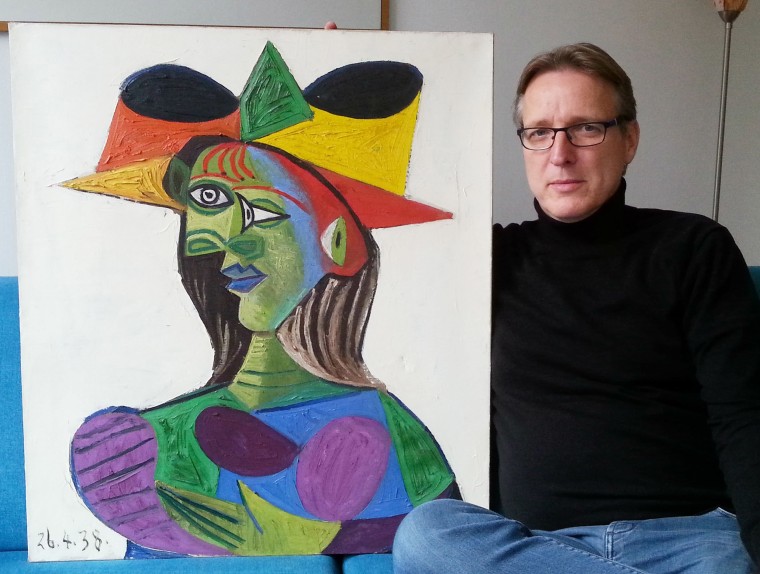 Image: Dutch art detective Arthur Brand posing with stolen Picasso painting Buste de Femme (Dora Maar)