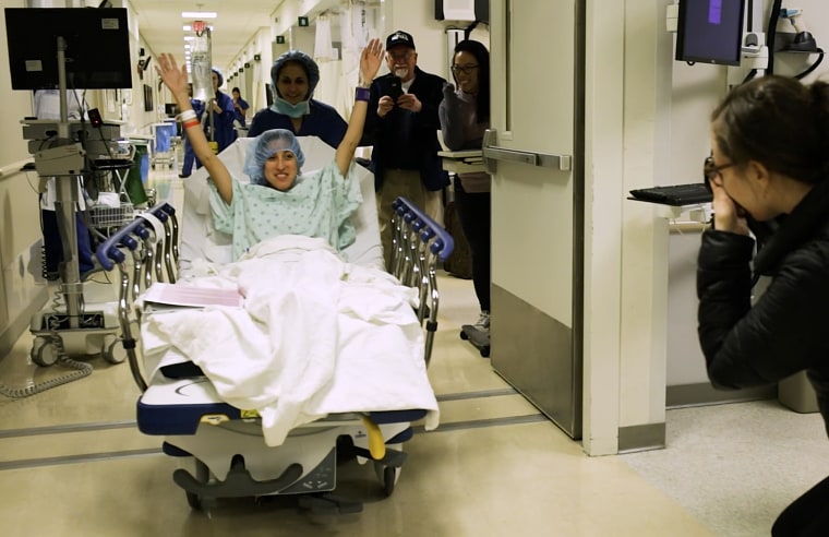 Image: Nina Martinez is wheeled into an operating room in Baltimore on March 25, 2019. Martinez donated a kidney to an HIV-positive person.