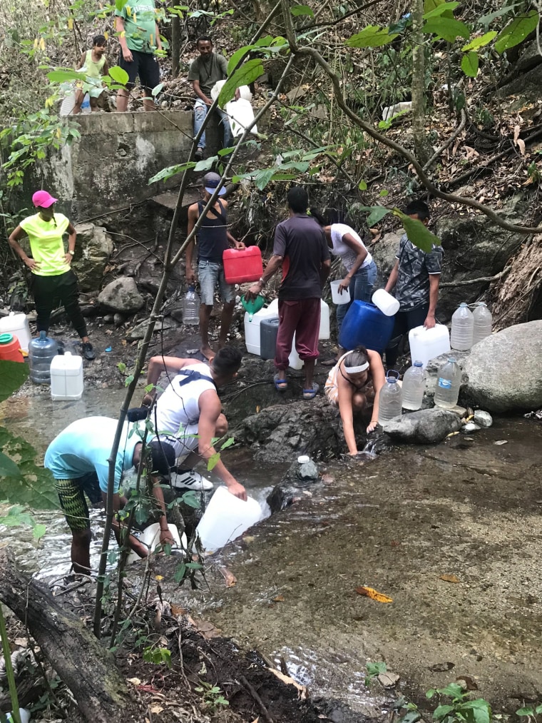 Image: Hundreds poured into a public park in Caracas where the river named Quebrada de Chaca?to offers people access to water. Many, who have been living without electricity or water for the past week if not longer, come here to collect water to bathe and