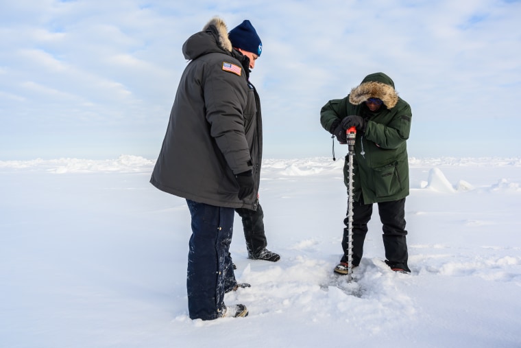 Al Roker drills into the Arctic ice at the NOAA weather station.
