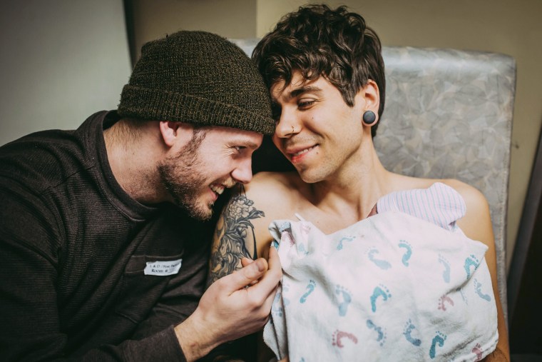 Image: Elliot Dougherty holds his daughter Uma after her delivery at the Nebraska Medical Center in Omaha, with husband Matthew Eledge