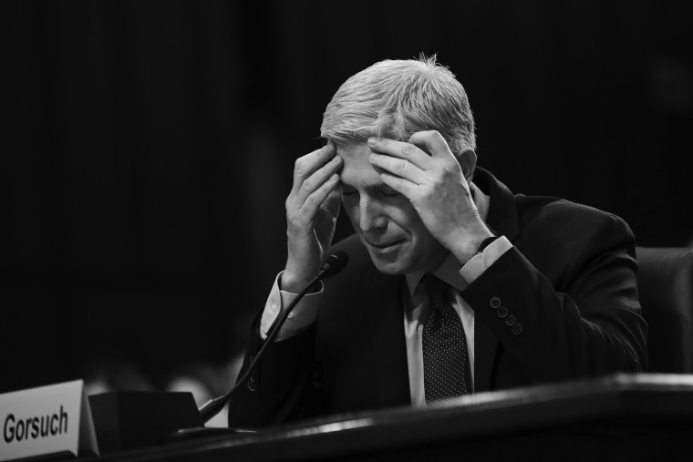 Image: Judge Neil Gorsuch pauses while testifying during second day of his Supreme Court confirmation hearing