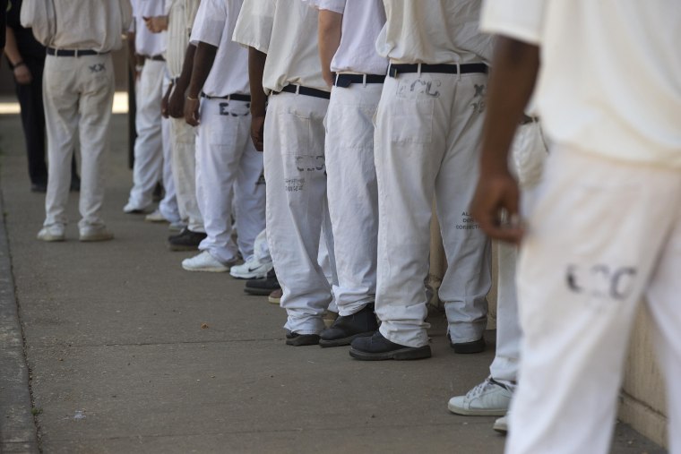 Image: Prisoners stand on a lunch line at Elmore Correctional Facility in Alabama on June 18, 2015.