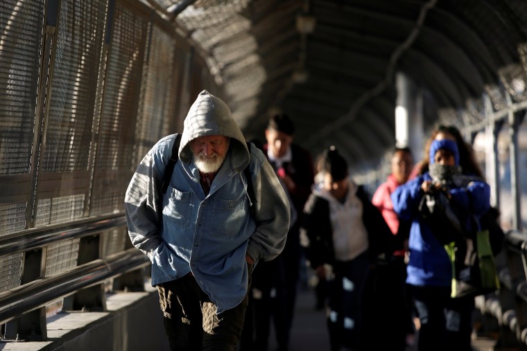 Image: Commuters are pictured while crossing toward El Paso, Texas, at Paso del Norte international border crossing bridge, in Ciudad Juarez