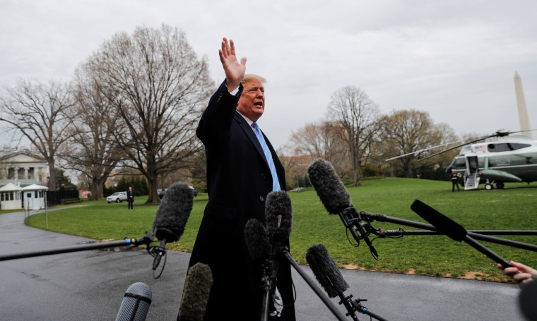 Image: U.S. President Trump talks to reporters departing on travel to the U.S. Southern border from the White House in Washington
