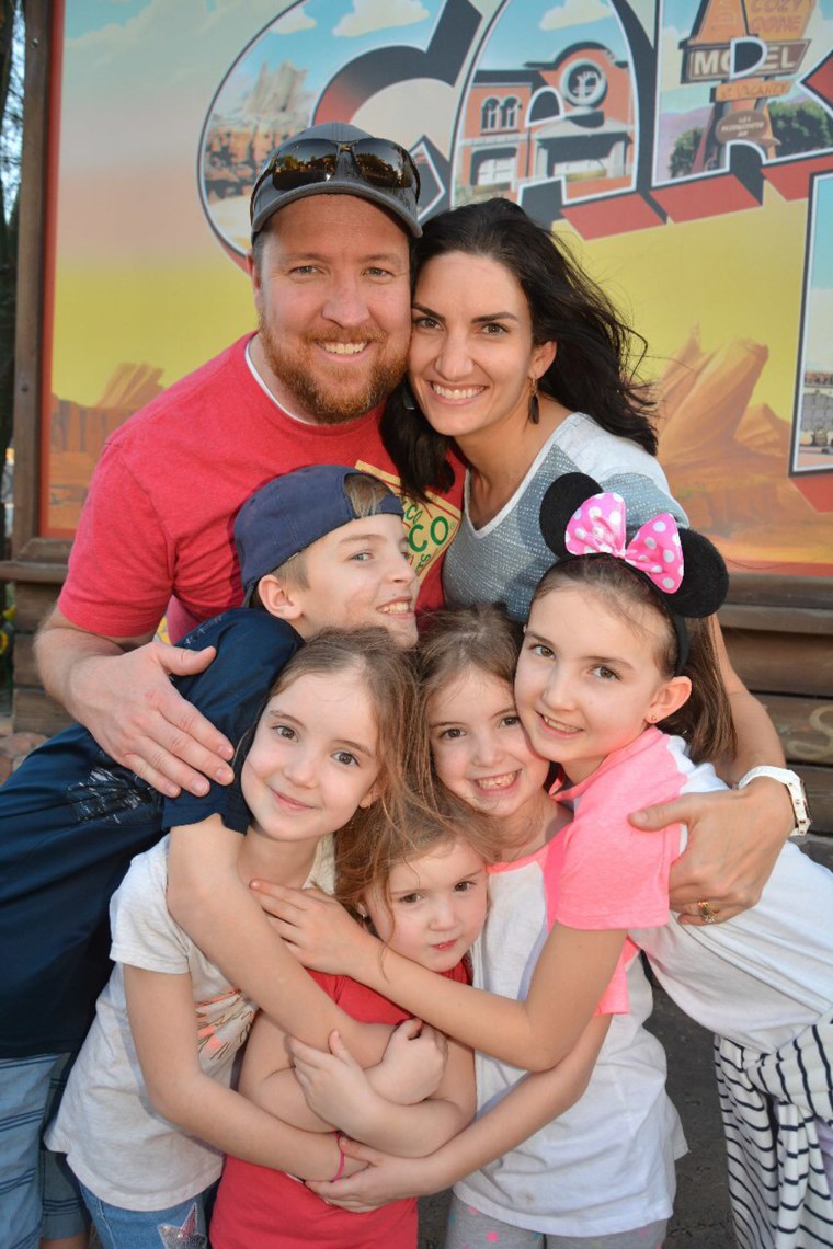 Sarah Bush, a Columbine survivor, poses for a photo with her family.