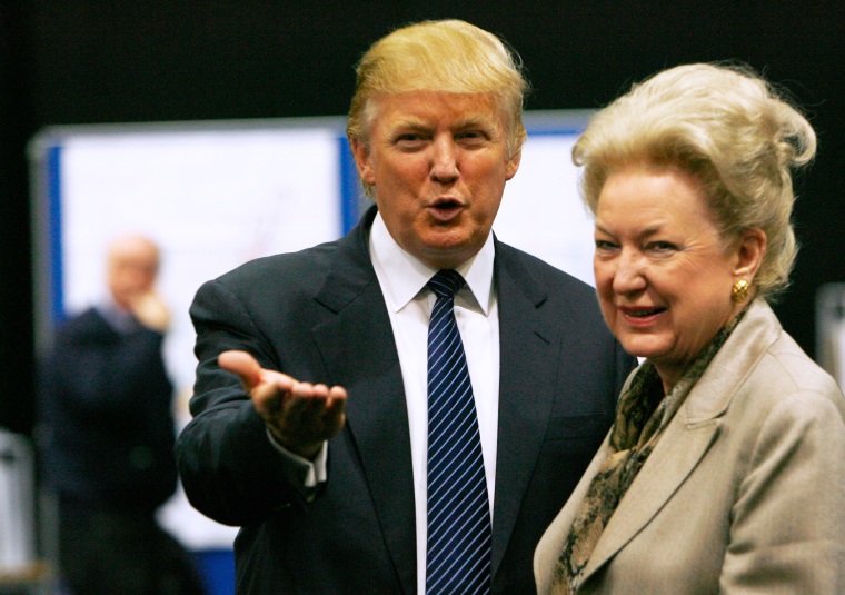 Donald Trump gestures as he stands next to his sister Maryanne Trump Barry, during a break in proceedings of the Aberdeenshire Council inquiry into his plans for a golf resort, Aberdeen