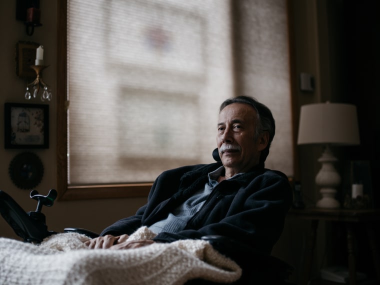 George Gallegos sits at his home.