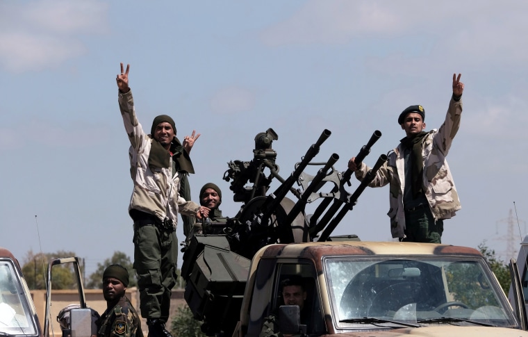 Image: Members of the self-styled Libyan National Army leave Benghazi