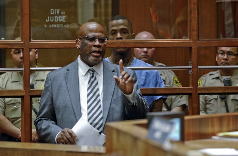 Image: Eric Holder's attorney Christopher Darden speaks in Los Angeles County Superior Court during a court appearance