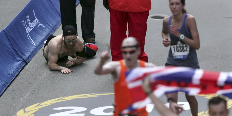 Marine crawls over finish line to complete Boston Marathon