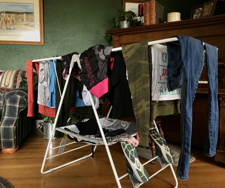 An entire load of laundry drying in the living room