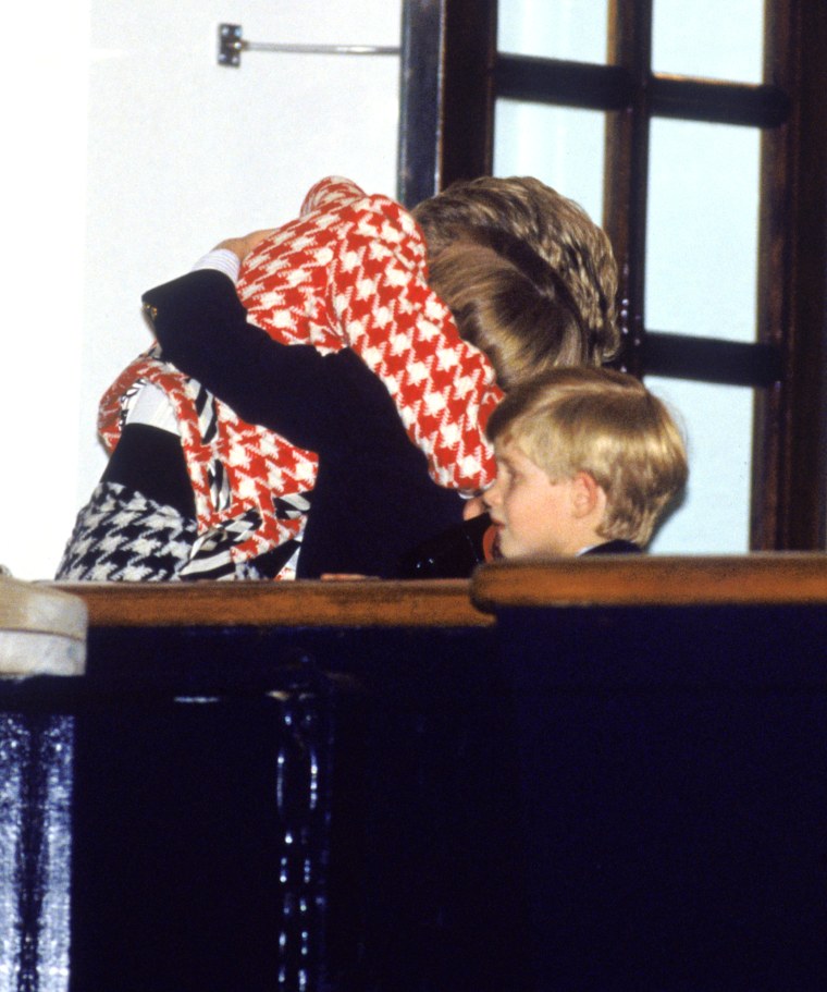 Princess Diana hugs her sons William and Harry aboard the Royal Yacht Britannia in Toronto in 1991.