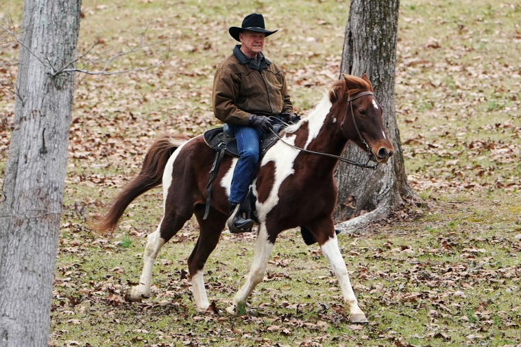 Image: Republican Senate candidate Roy Moore arrives on his horse to cast his ballot in Gallant, Alabama