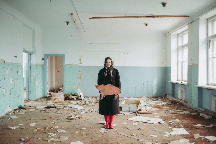 Image: Alisa Gorshenina poses in an abandoned school in Yakshina, Russia