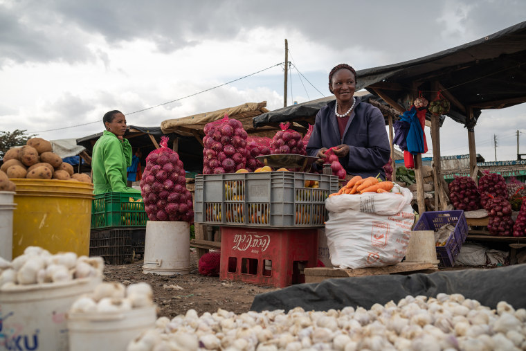 Image: Eunice Ngima runs a small roadside vegetable stall in Kiawara, Kenya