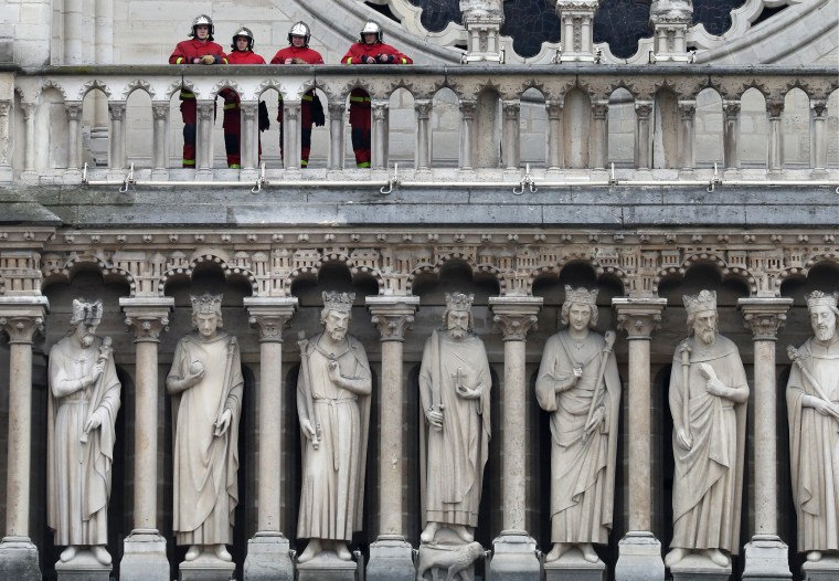 Image: Firefighters at Notre-Dame Cathedral on Tuesday