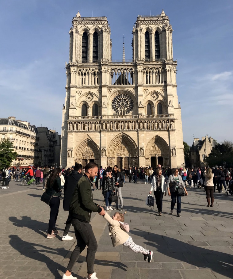 Image:  Brooke Windsor took a photo of a father and daughter dancing outside the Notre Dame before a fire broke out at the cathedral on April 15, 2019.