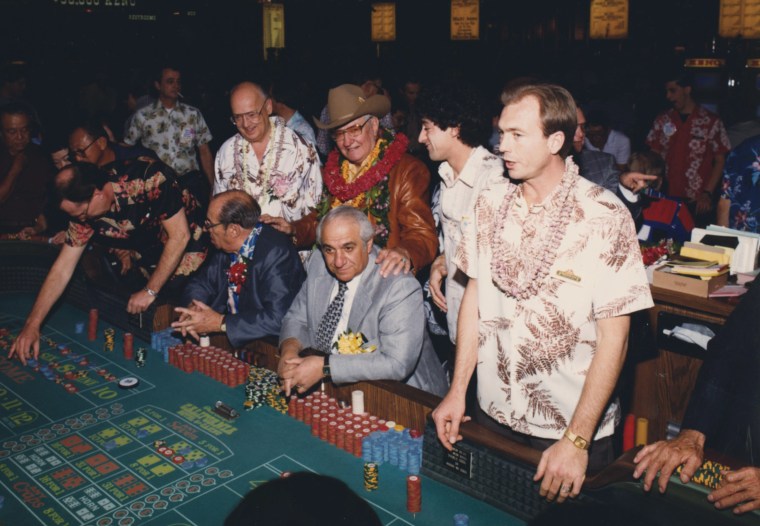 Sam Boyd center, wearing a hat, on the casino floor of the California Hotel and Casino in Las Vegas.