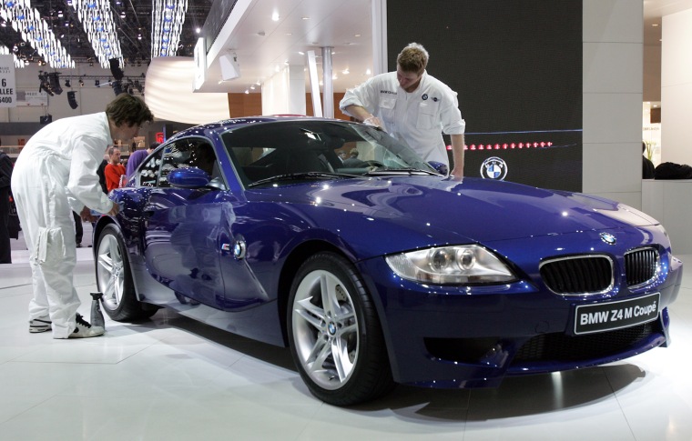 BMW employees wipe new BMW Z4 M Coupe which is on display as a first world presentation at the 76th Geneva motor show