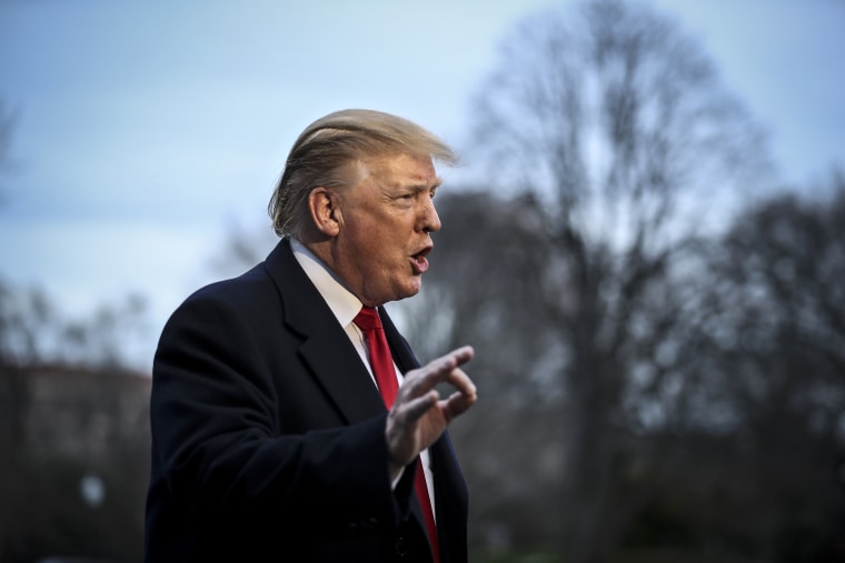 WASHINGTON, DC - MARCH 24: President Donald Trump talks to memb