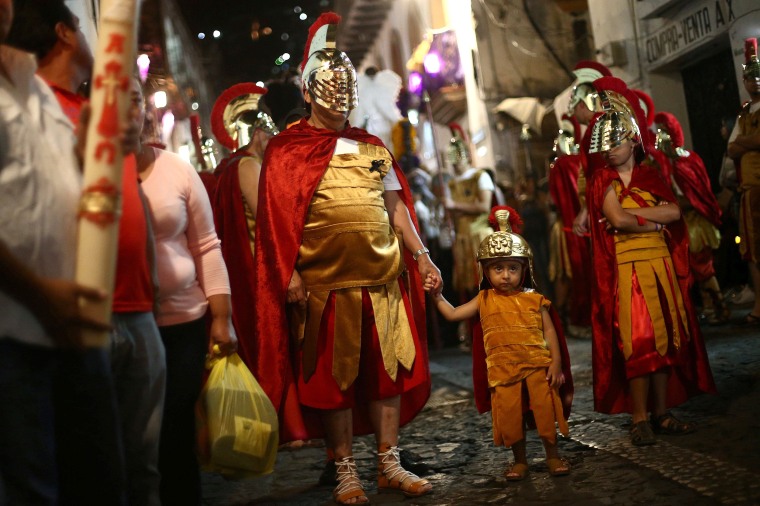Image: Men dressed as ancient Romans take part in a procession as part of Holy Week celebrations in Taxco